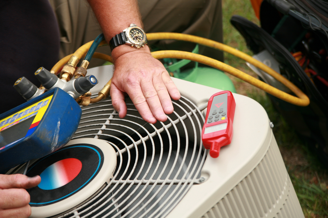 Technician Working on AC Unit