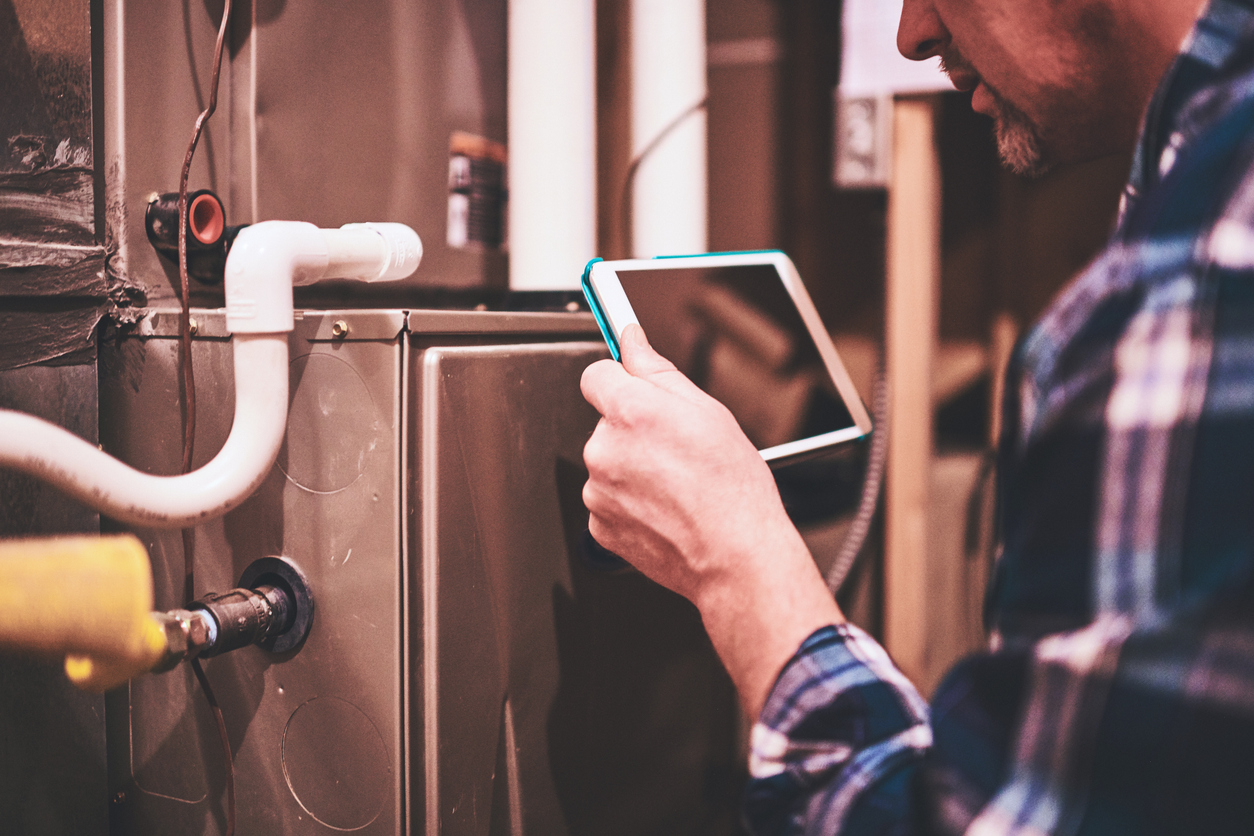 Technician Doing Furnace Inspection